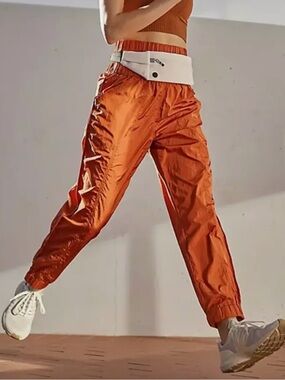 NWOT FP Movement Size Medium “The Way Home” Orange Joggers